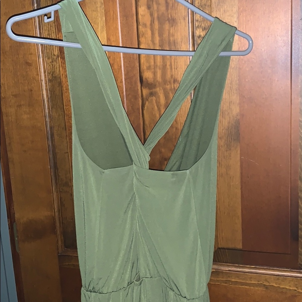 Olive green jumpsuit. Multi-wear straps